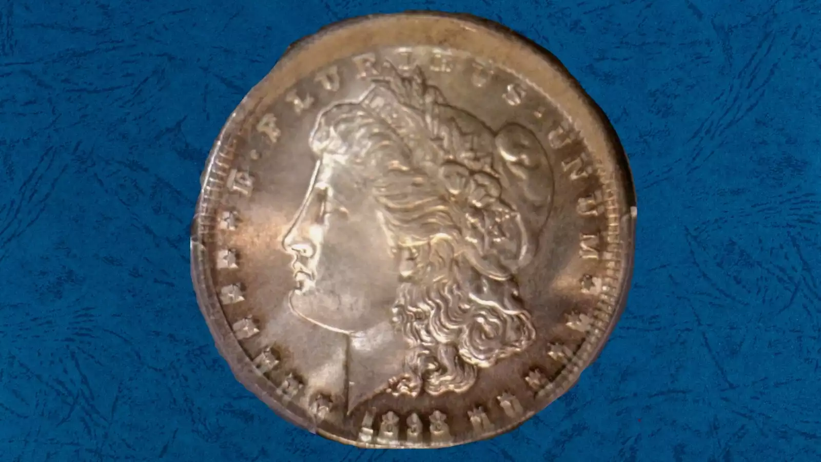 1898 Morgan dollar broadstrike or off-center strike error showing expanded planchet and weak or absent collar rim